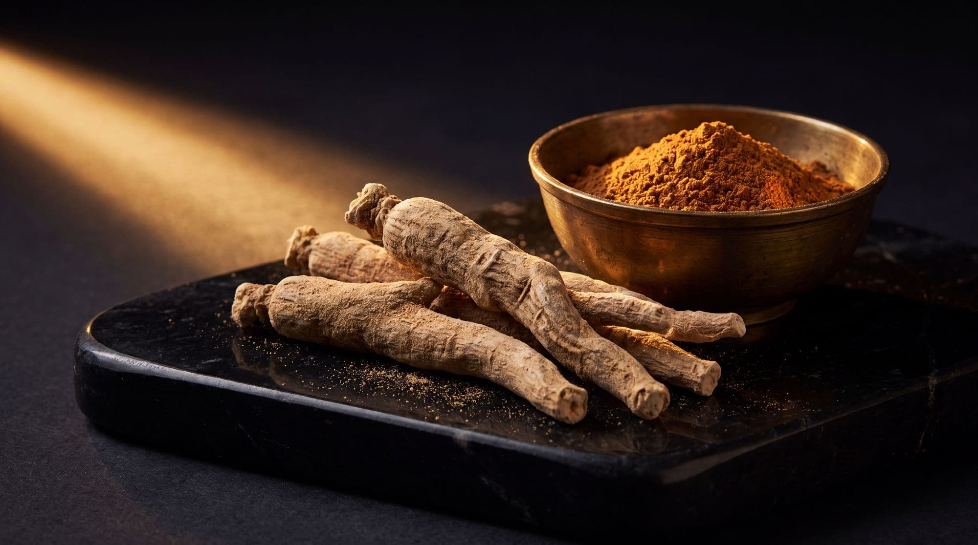 Ashwagandha roots beside a mound of ochre powder